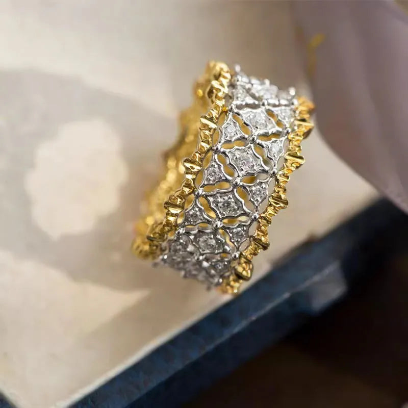 Geometric round two-tone gold zircon ring on a copper band, shown in UK ring sizes 6 to 10.
