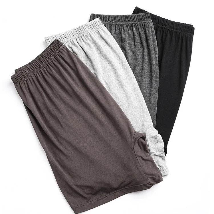 Men's solid colour modal boxers with a high waist, shown in black, blue, grey, and brown.