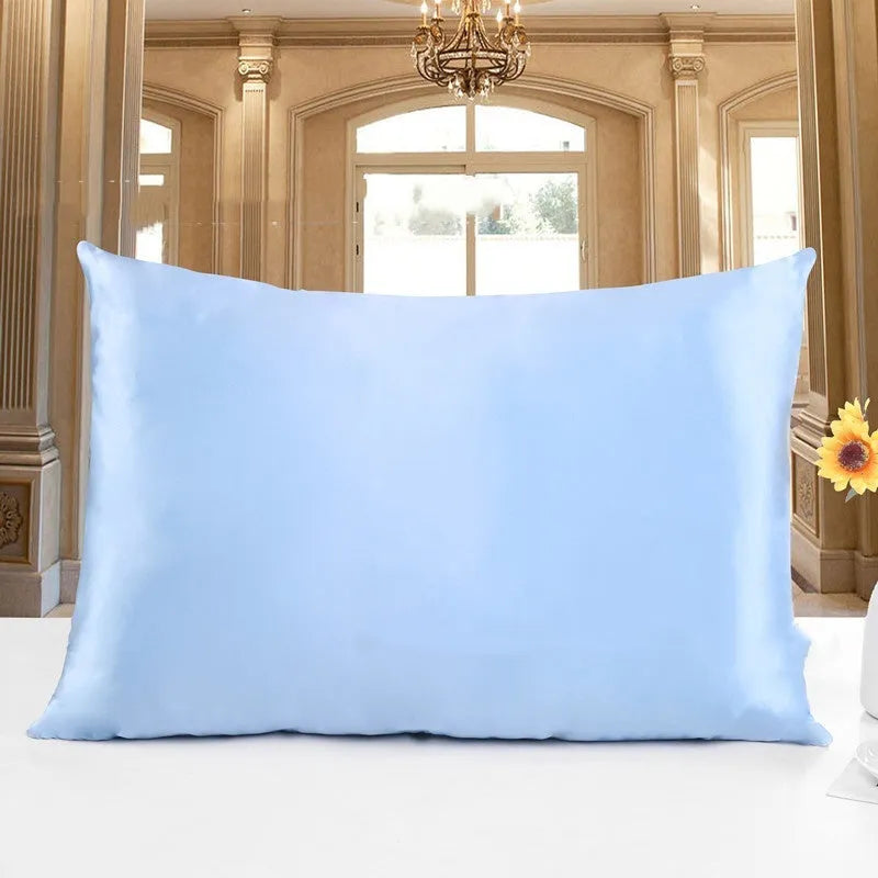 19 M double-sided silk pillowcase shown in one of 14 available colours, including apricot, sky blue, and black.