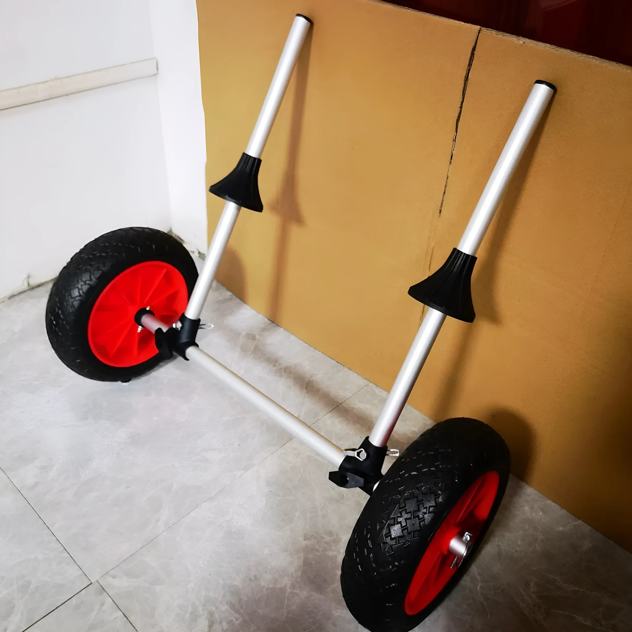 Foldable aluminium kayak beach trailer cart with upright pole and rubber components.