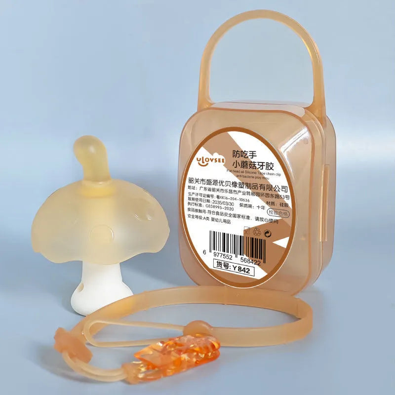 Small pink mushroom-shaped chew toy with a nano chain on a white background, inside a transparent box.