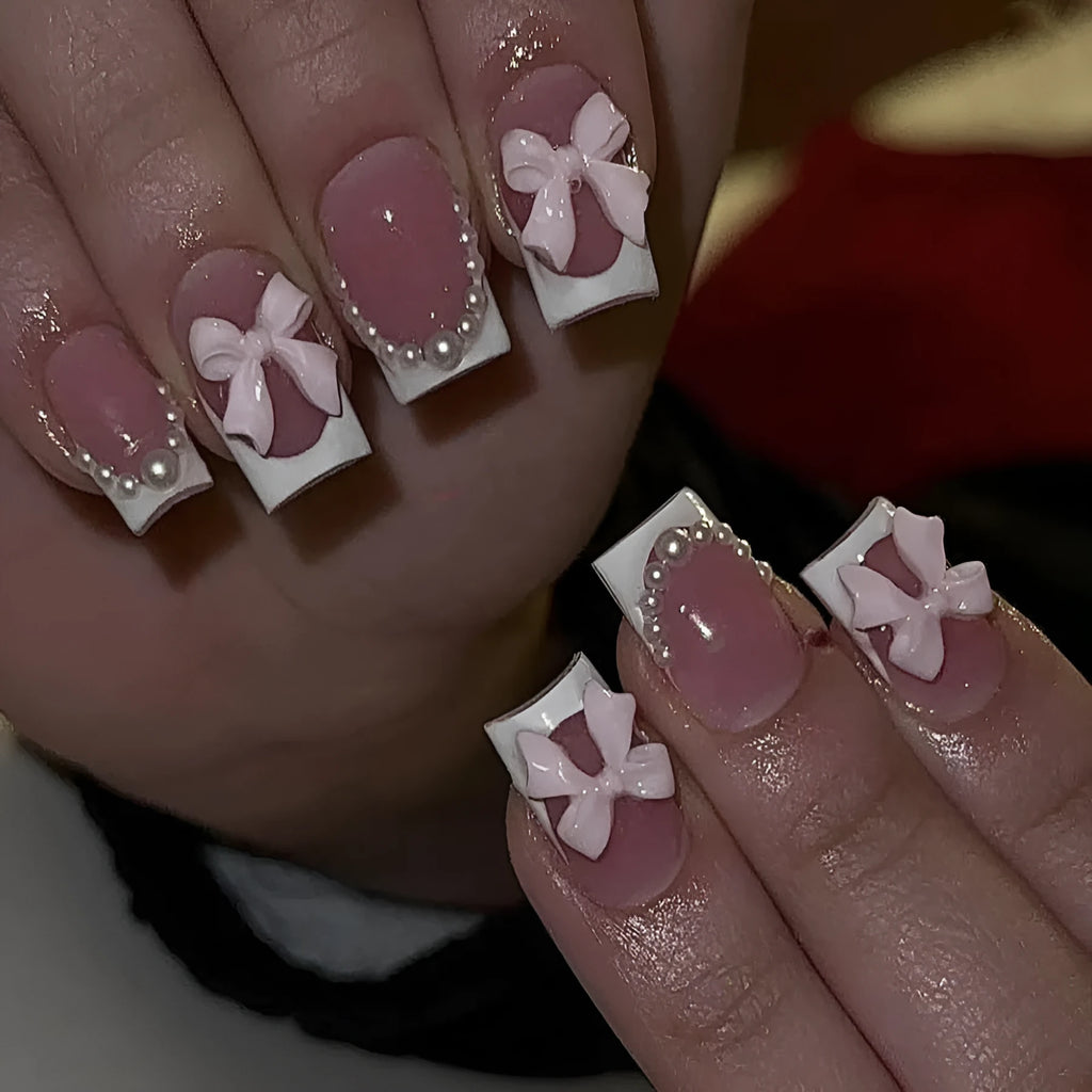 Short white French manicure press-on nails with bow, tulip, and starry sky decorative patterns