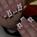 Short white French manicure press-on nails with bow, tulip, and starry sky decorative patterns