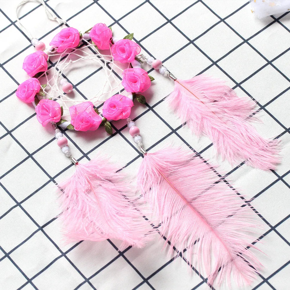 Pink ostrich feather dreamcatcher wind chime wall decoration measuring 10cm
