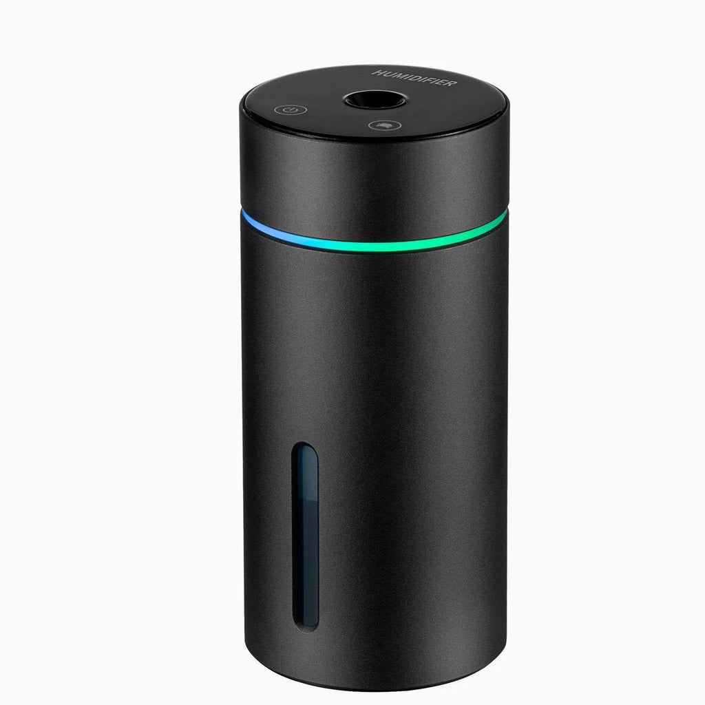Black aluminium portable car humidifier diffuser with night light on a car dashboard