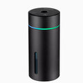 Black aluminium portable car humidifier diffuser with night light on a car dashboard