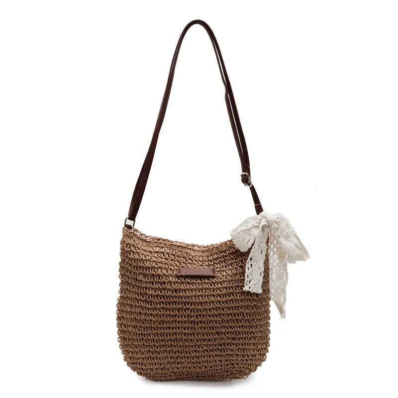 Women's woven straw messenger bag with hollowed pattern design in beige colour
