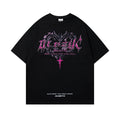 Man wearing a black retro print cotton t-shirt with loose fit and short sleeves.