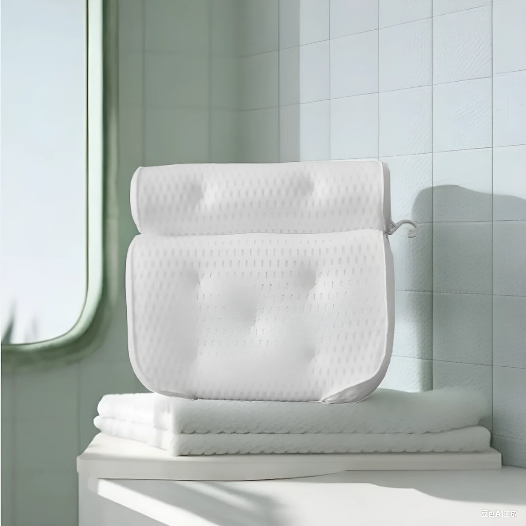 White 4D mesh bathtub pillow with suction cups on a bathtub edge.