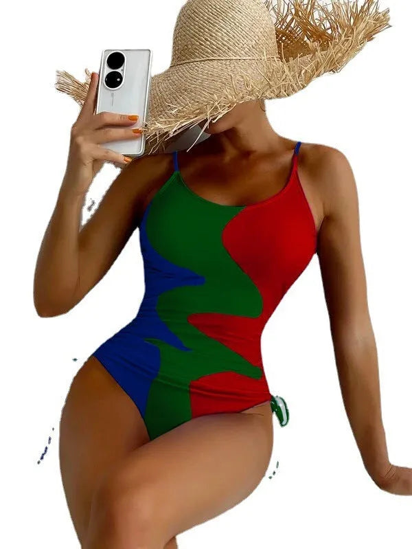 Women's sleeveless one-piece swimsuit in blue, shown from the front, with a backless design and striped pattern.