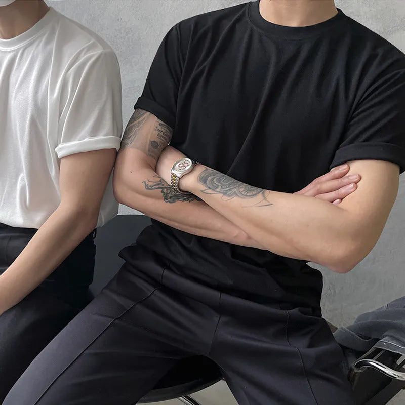 Men's slim fit cotton t-shirt in white or black with round neck and half sleeves.