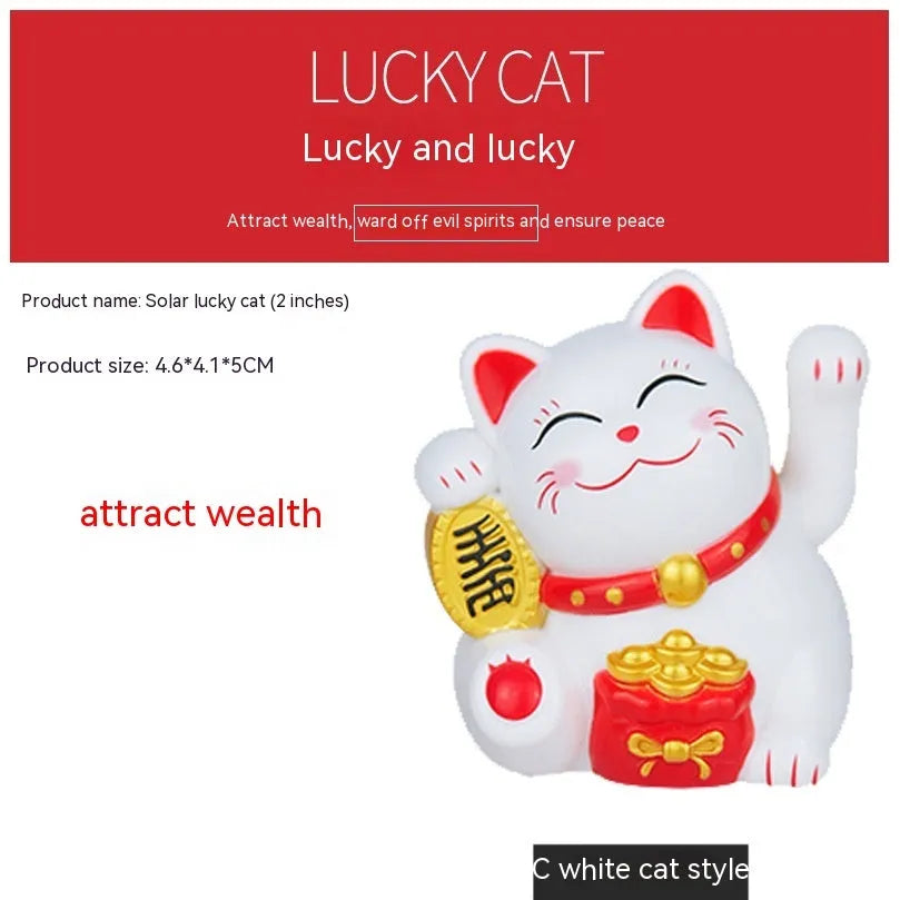 Solar-powered yellow Maneki Neko lucky cat decoration waving its arm