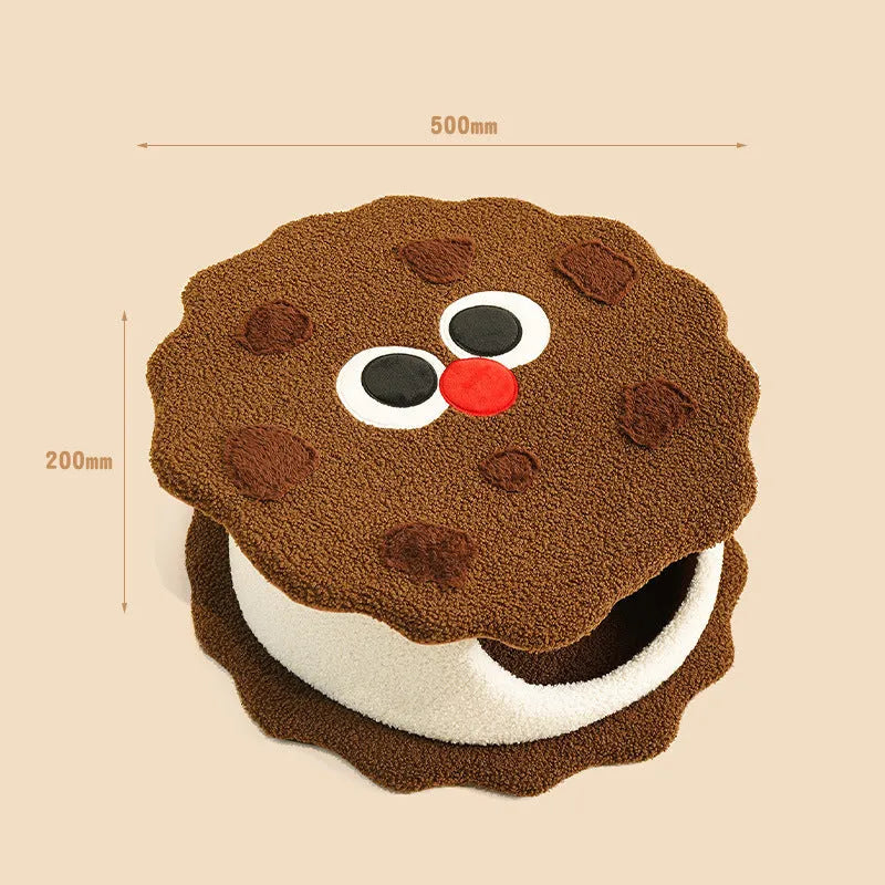 Khaki coloured enclosed cat house shaped like sandwich cookie with removable cushion for winter sleeping