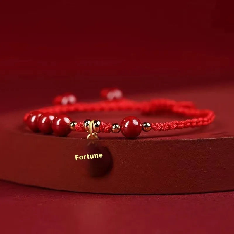 Cinnabar ethnic bracelet with braided rope strap and blessing charm for exam luck symbolism