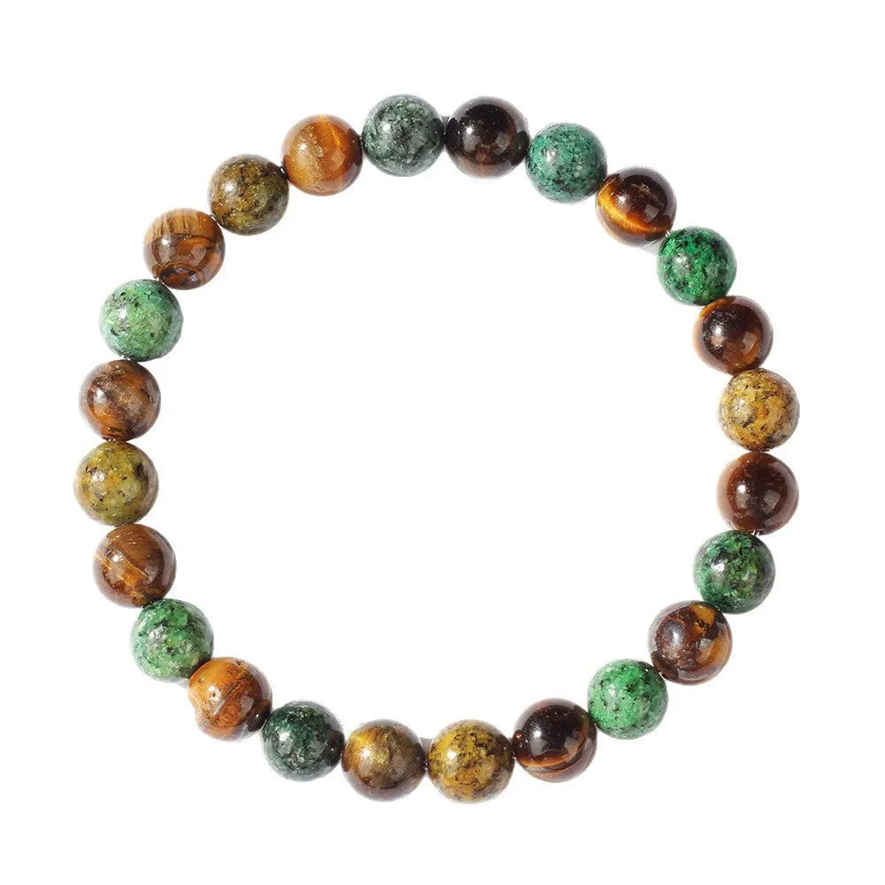 Handmade tigereye stone bracelet with 18mm flower bead in antique style on wrist.