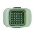 Green hand-operated vegetable chopper with stainless steel blades for slicing onions, potatoes, radishes and cucumbers