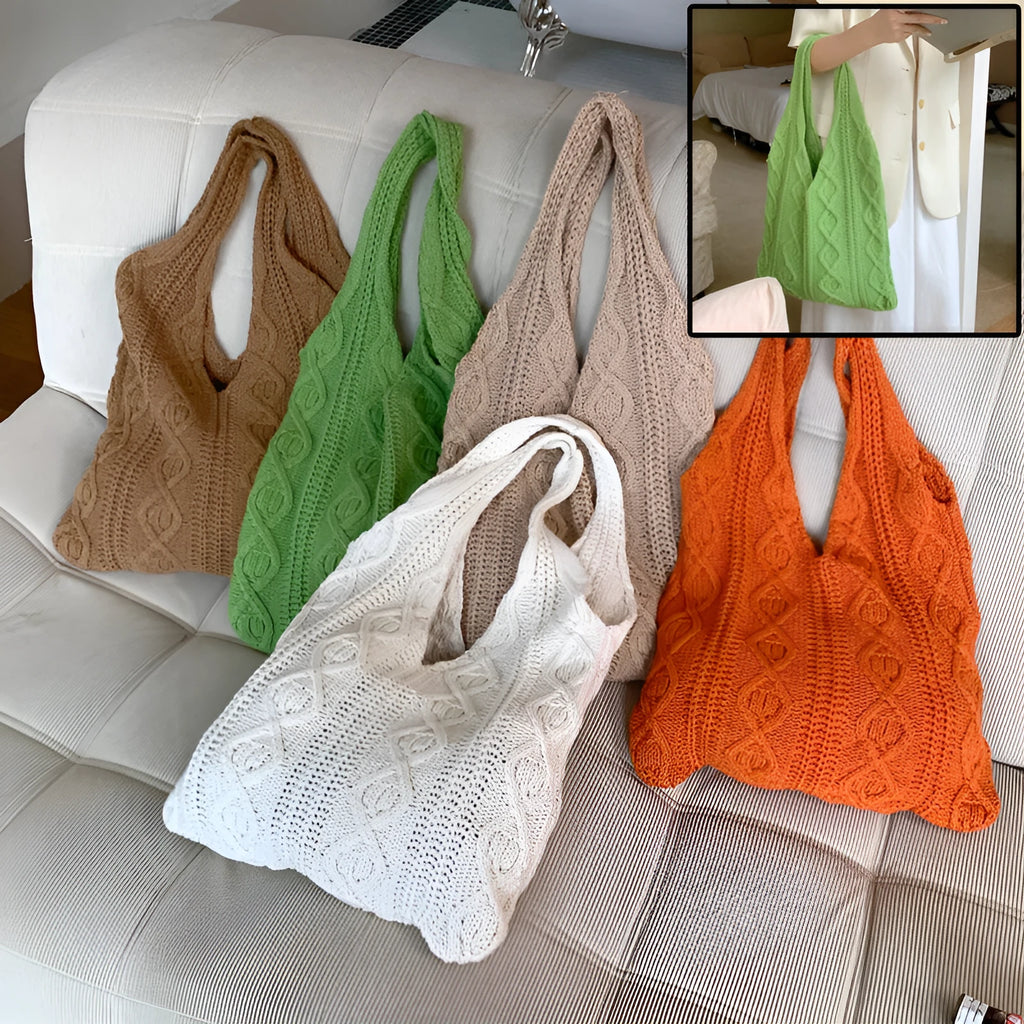 Women's retro-style hollow-knitted wool yarn tote bag in a solid colour, showing double shoulder straps.