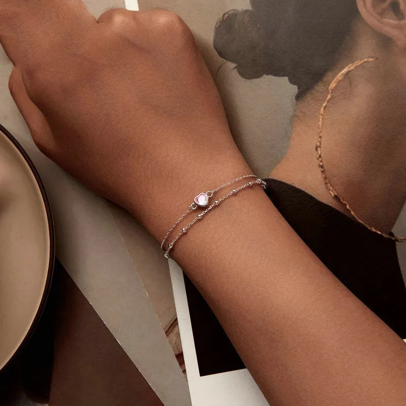 Women's sweet style 925 sterling silver bracelet with small heart charm on an adjustable chain.