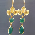 Gold-coloured copper drop earrings with a French leaf design, water drop zircon, and tassel detail.