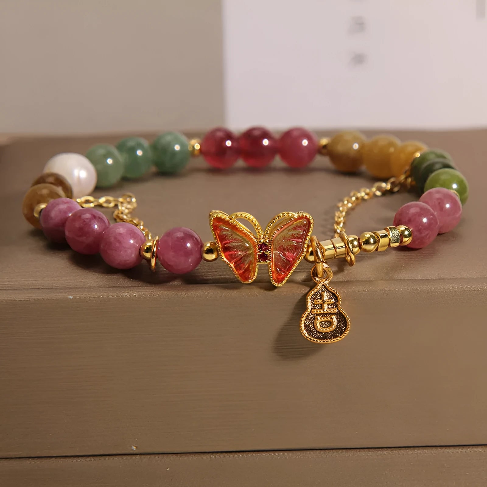 Natural jade coloured agate bracelet with a butterfly gourd design for women.