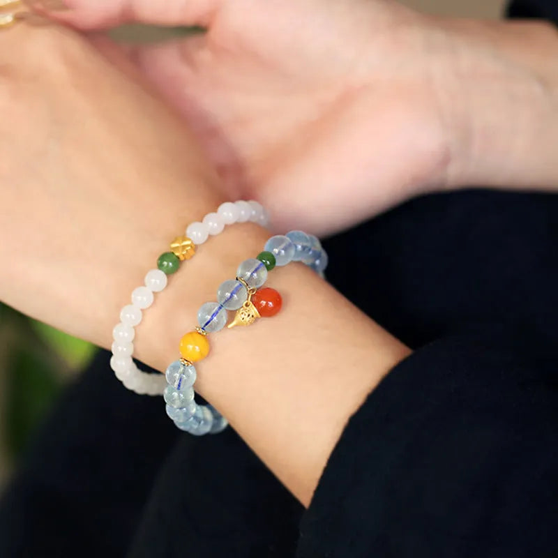 Women's aquamarine crystal bracelet with 8mm geometric beads in transparent iced blue colour