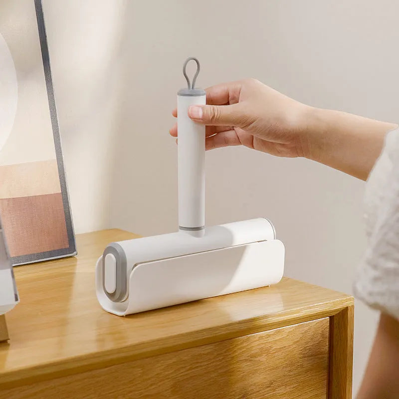 Pet lint remover roller tool with tearable paper sheets for cat hair removal from floors