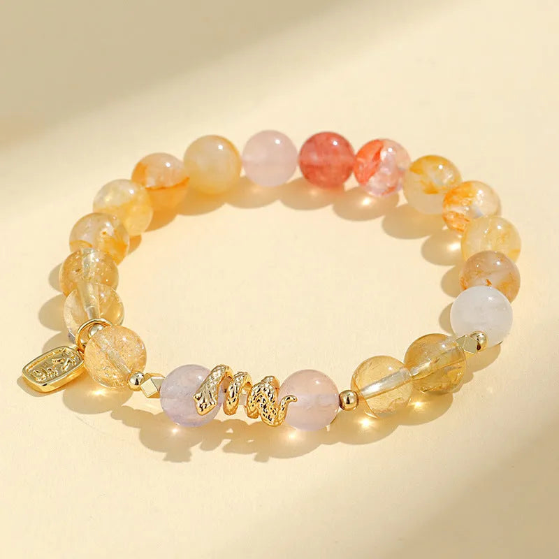 Handmade women's crystal lucky bracelet with Fu snake charm and amethyst beads.