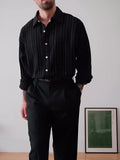 Black pinstriped button-down polyester shirt with regular fit on mannequin