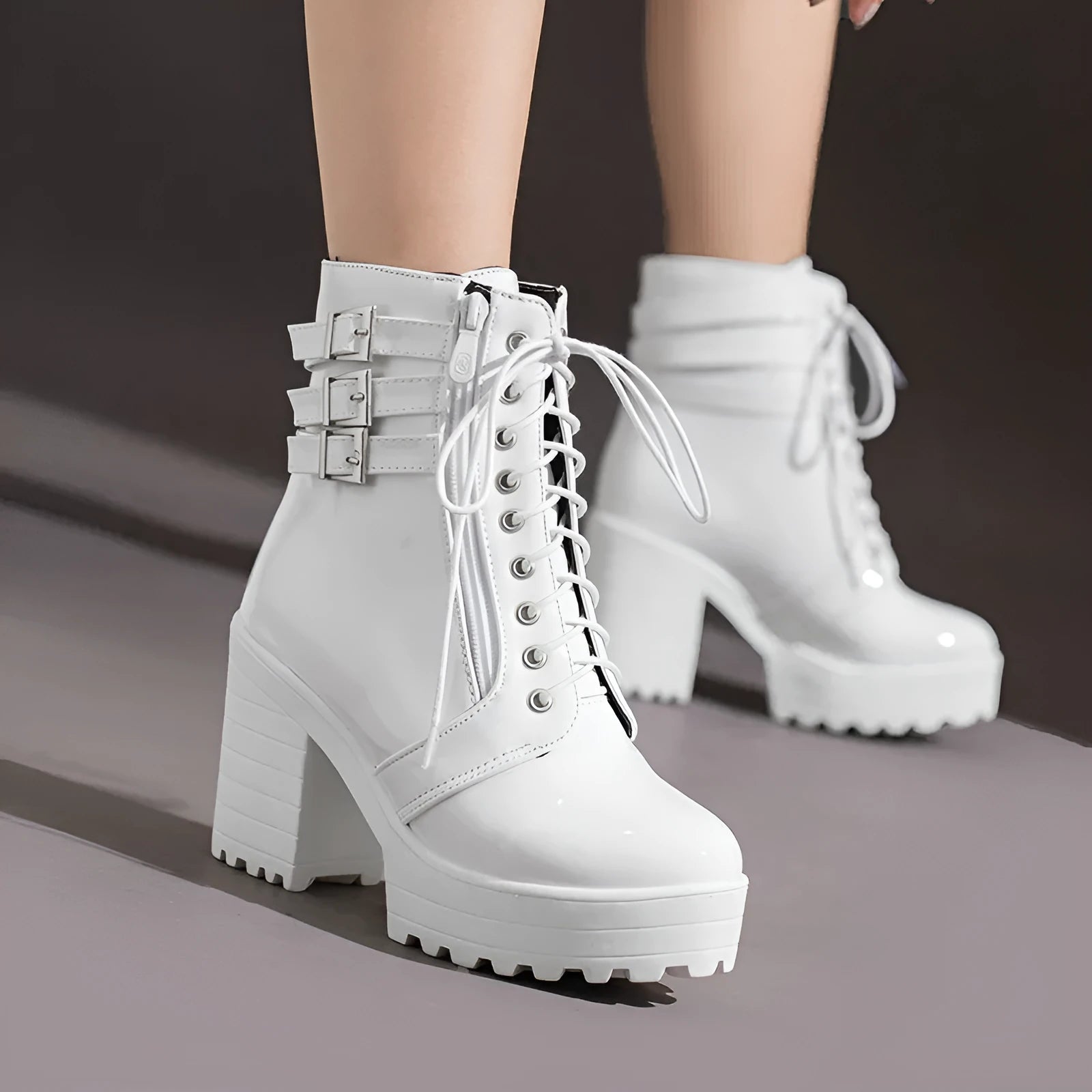 Women's black chunky heel ankle boots with lace-up front and round toe.