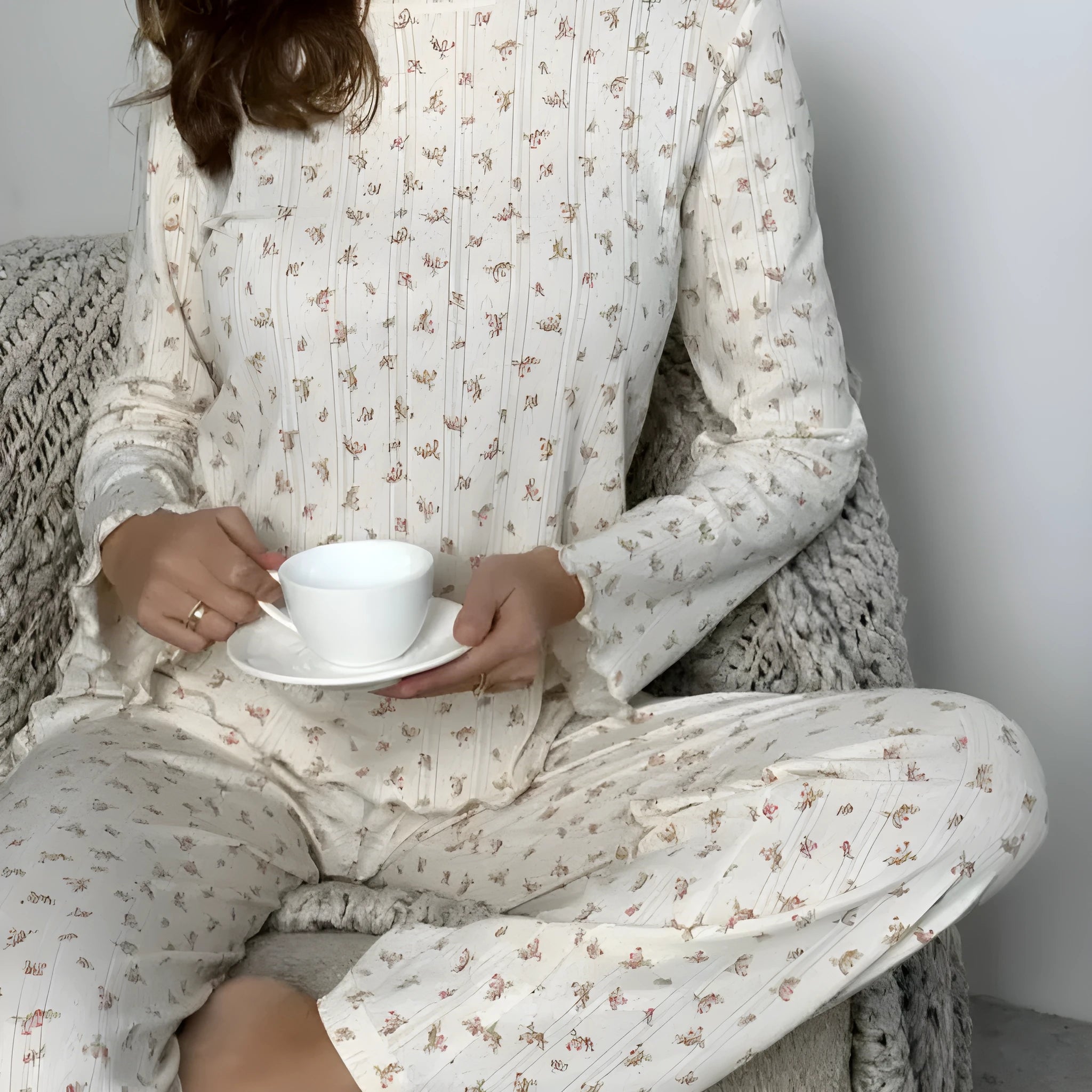 White floral print women's suit with long bell sleeve top and wide-leg trousers