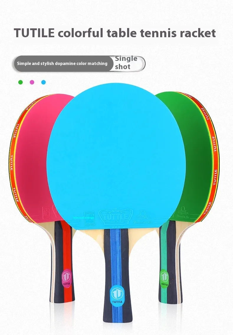 Blue, green, and pink shakehand grip table tennis rackets with matching racket covers laid out.