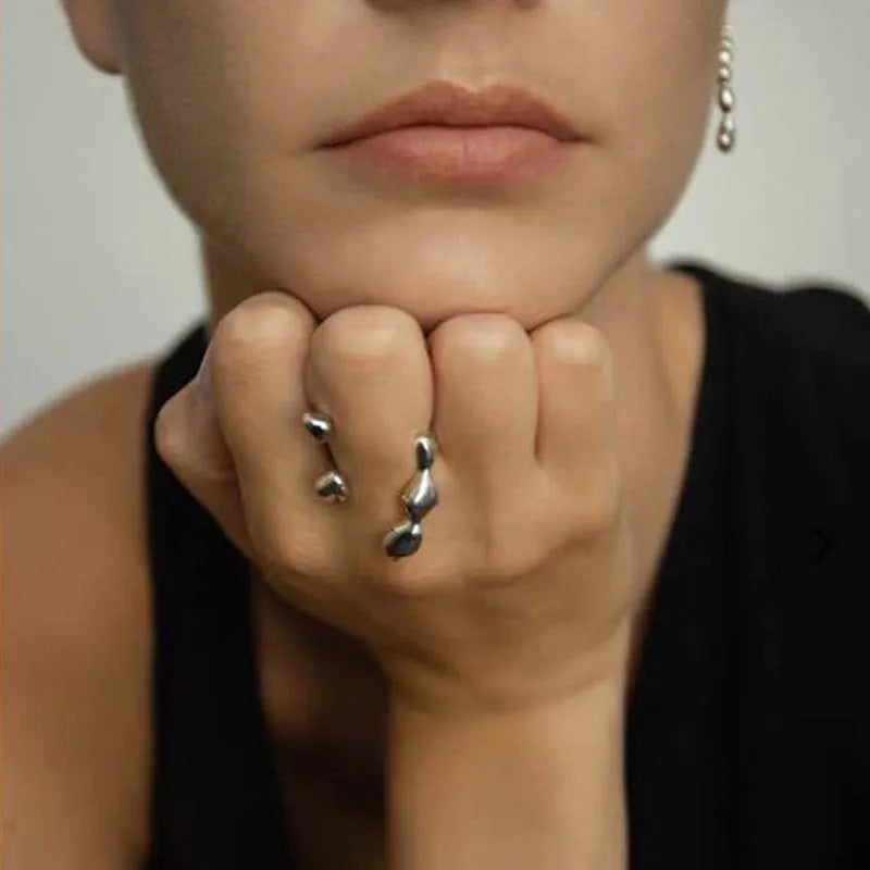 Brass fashion ring with spherical elements in circular design available in gold and silver colours