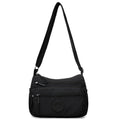 Water-repellent nylon crossbody bag with three-dimensional pockets in grey, black or red options