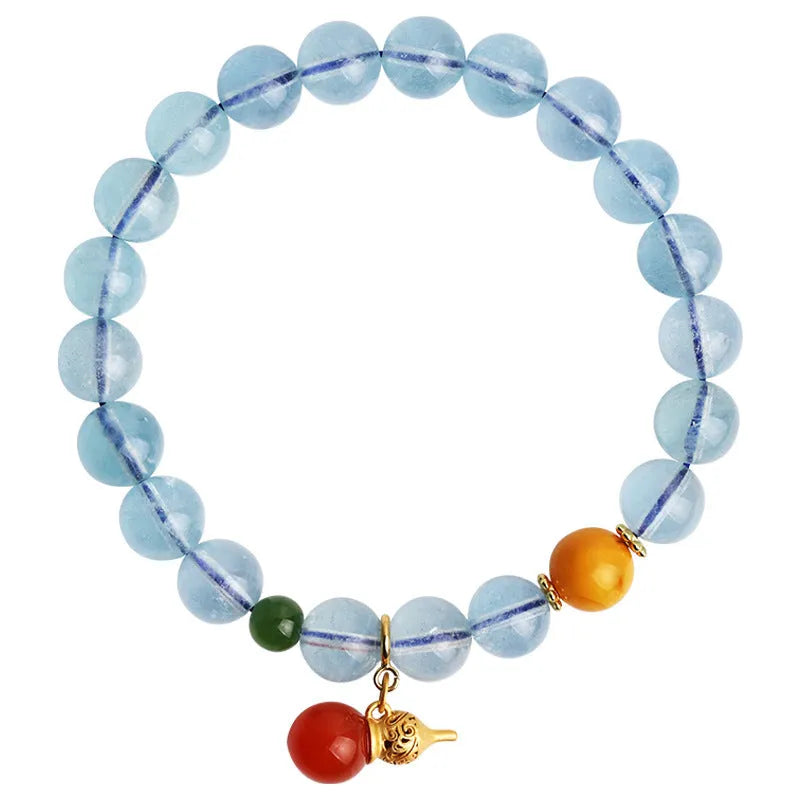 Women's aquamarine crystal bracelet with 8mm geometric beads in transparent iced blue colour