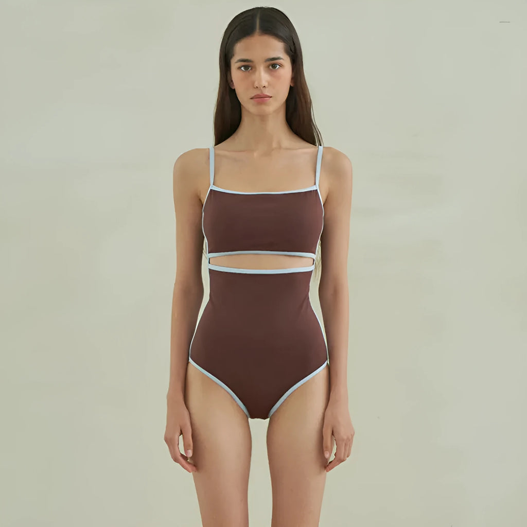 Brown women's one-piece swimsuit with triangle top design on a mannequin