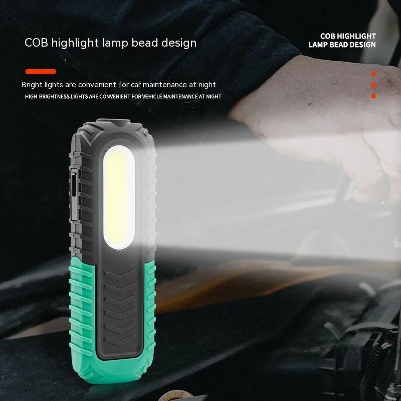 Black and green USB-charged auto repair work light with compact design for vehicle maintenance