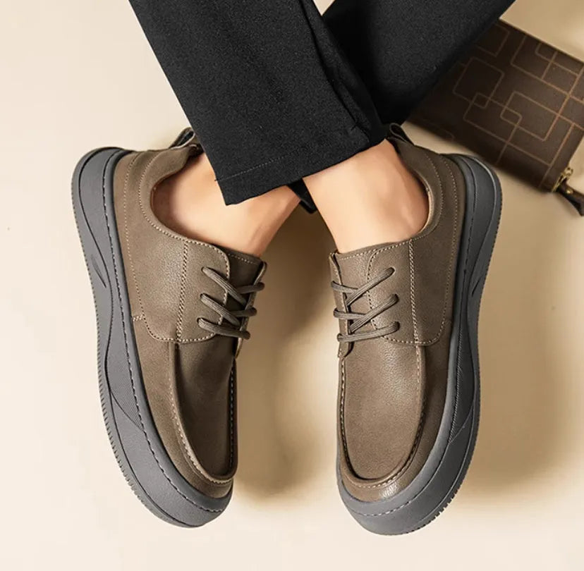 Brown retro-style casual leather shoes with big toe design on a neutral background