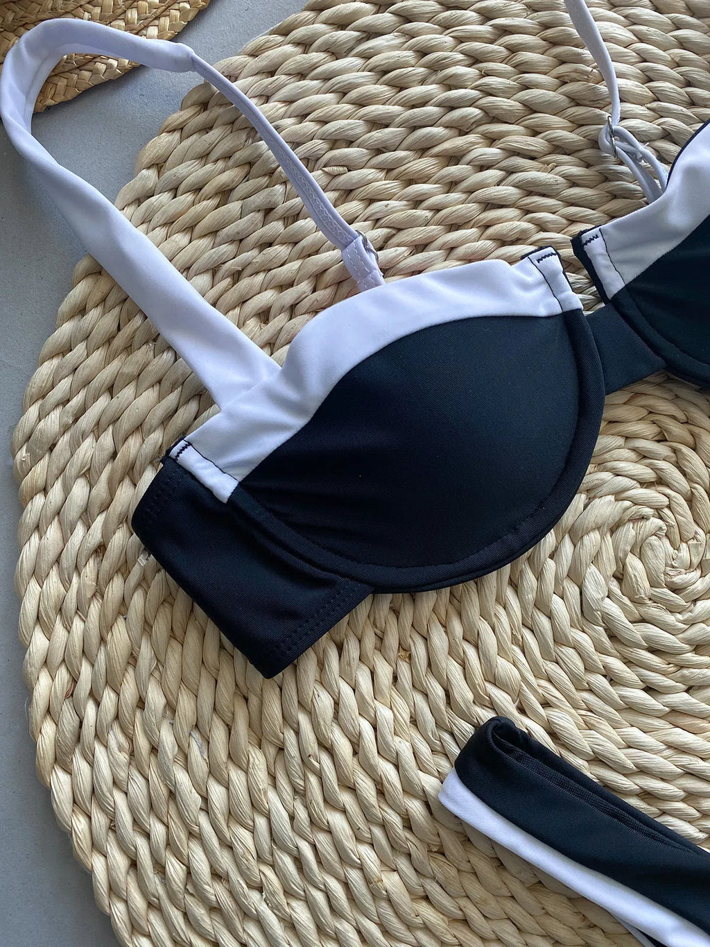Black women's bikini briefs with stitching detail, nylon fabric, sizes S M L.