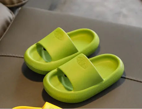Children's mixed colour EVA slippers with a non-slip sole, shown in blue, green, orange, pink, and yellow.