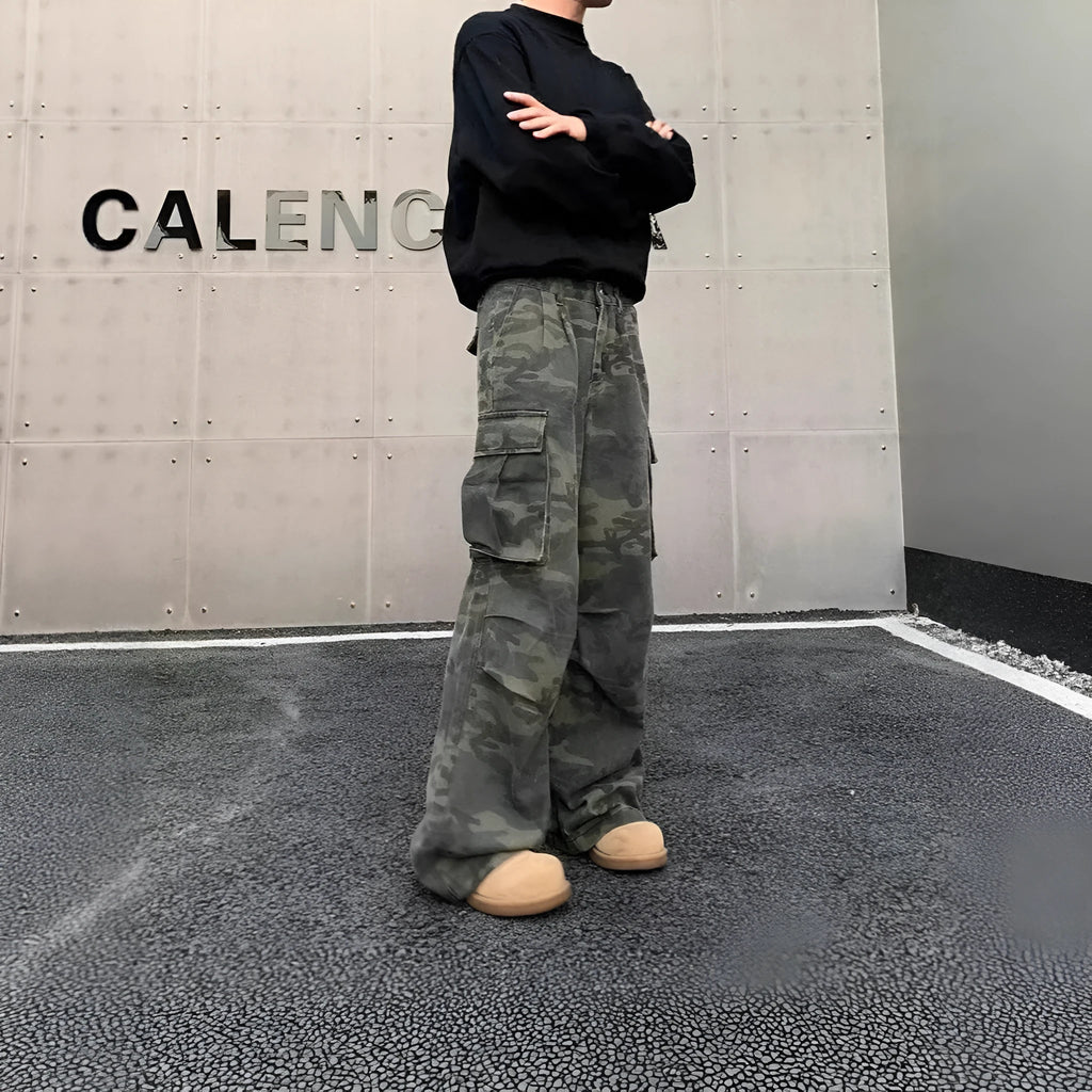 Men's washed camouflage cargo trousers with multiple pockets showing cotton blend fabric