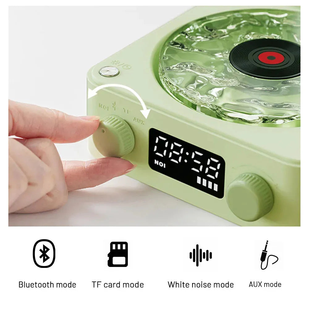Blue retro-style Bluetooth speaker with rotating transparent turntable and RGB projection lighting