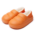 A pair of waterproof EVA couple slippers in green with a plush lining and non-slip sole.