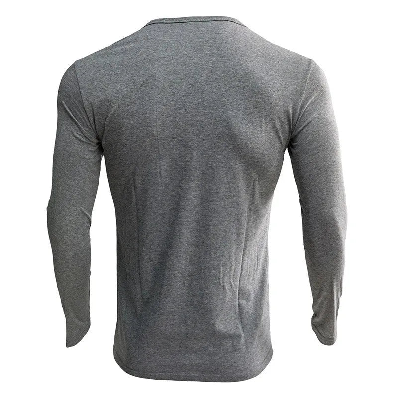 A solid colour long sleeve men's henley shirt in a cotton blend fabric.