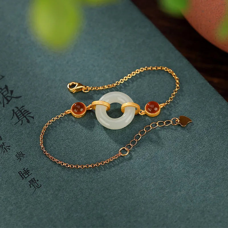 Gold-plated sterling silver bracelet with natural Hetian jade stone and peace buckle closure