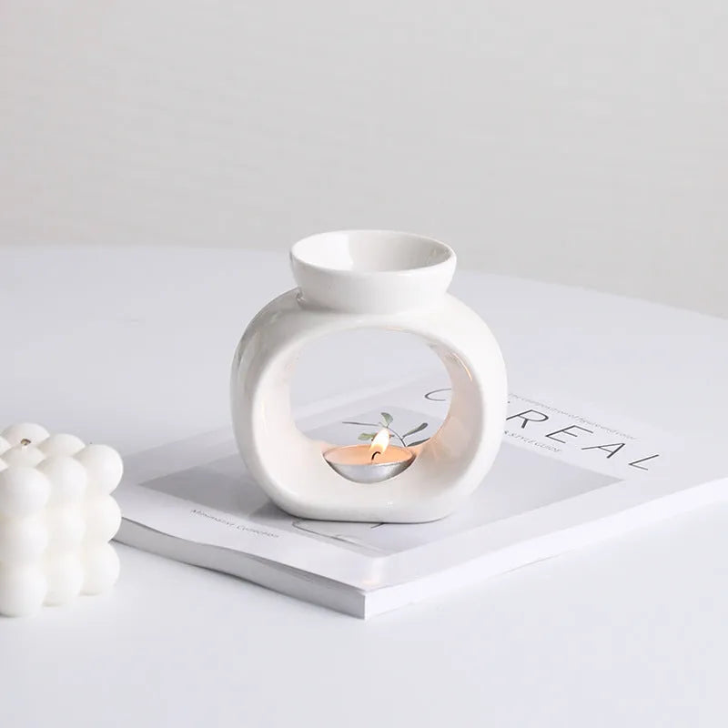 White Nordic style ceramic aromatherapy stove ornament on display