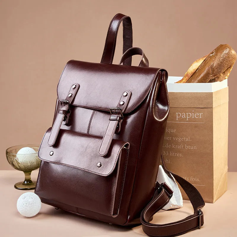 Genuine leather cowhide backpack with hard texture construction and internal lining for laptop organisation