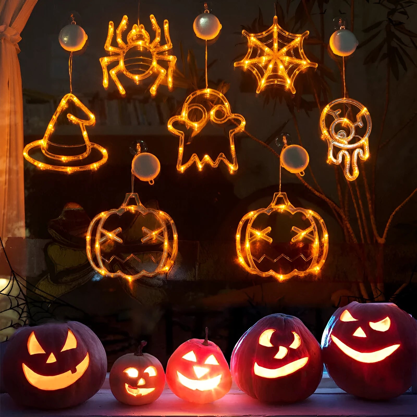 Halloween window hanging LED lights set with seven plastic decorations including spider, pumpkin, and ghost designs