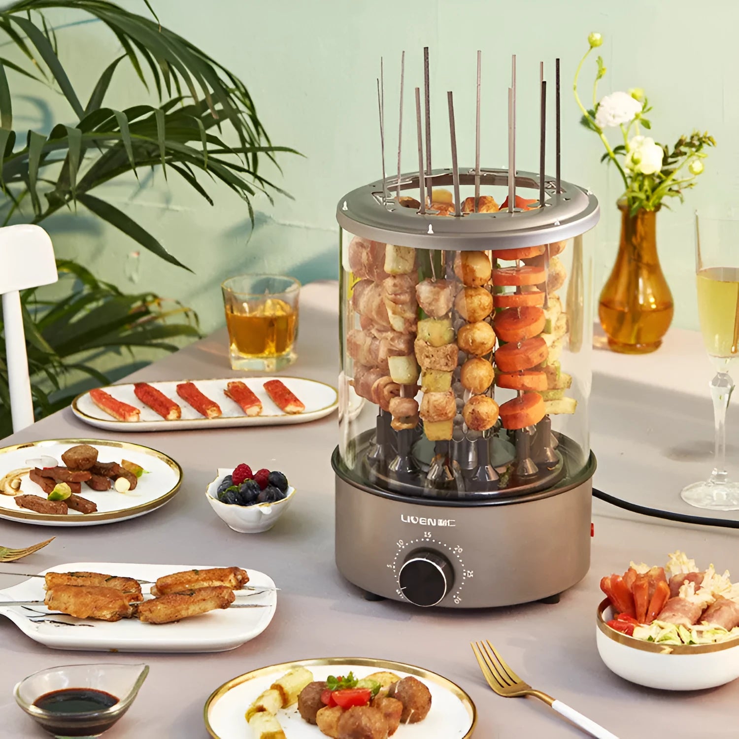 Household electric barbecue oven with automatic rotation, 210mm diameter, 1100W, on a kitchen counter