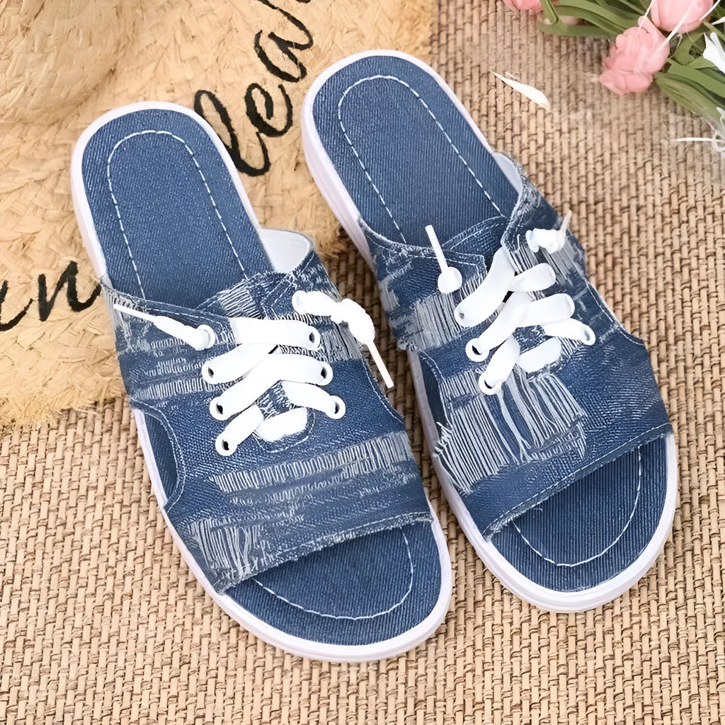 Blue Roman-style women's canvas slippers with flat design and rubber sole