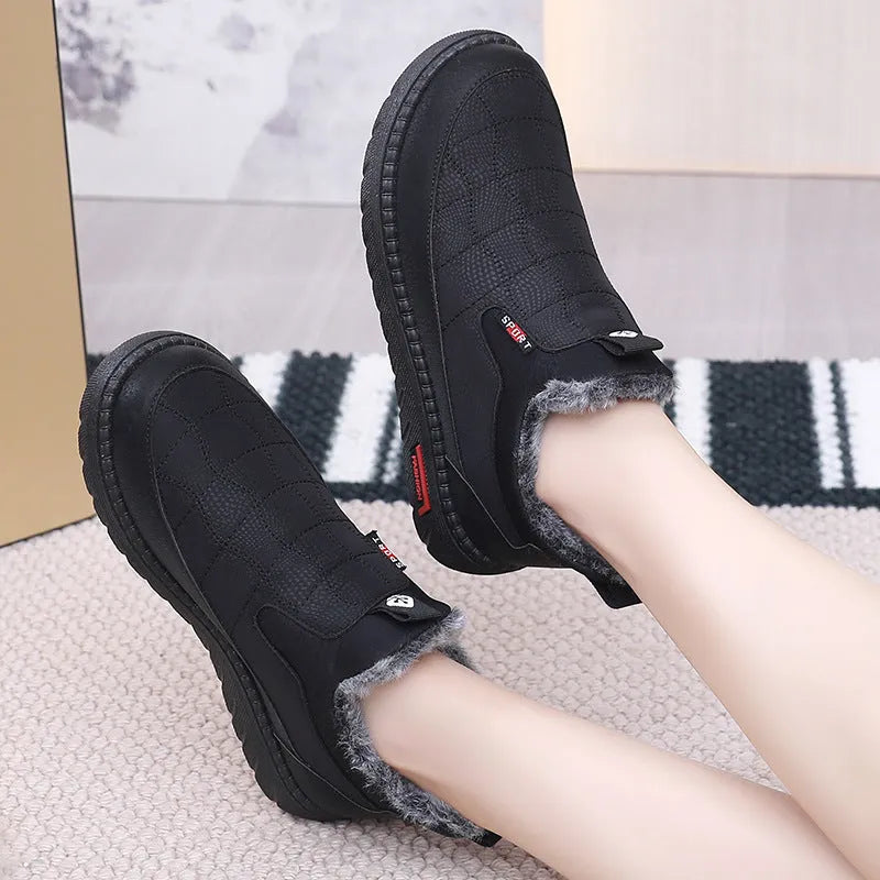Women's black casual flat boots with round toe and non-slip rubber sole